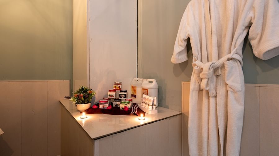 View of essentials placed next to bathrobe at DLS Highland Resort and Spa, Mussoorie.